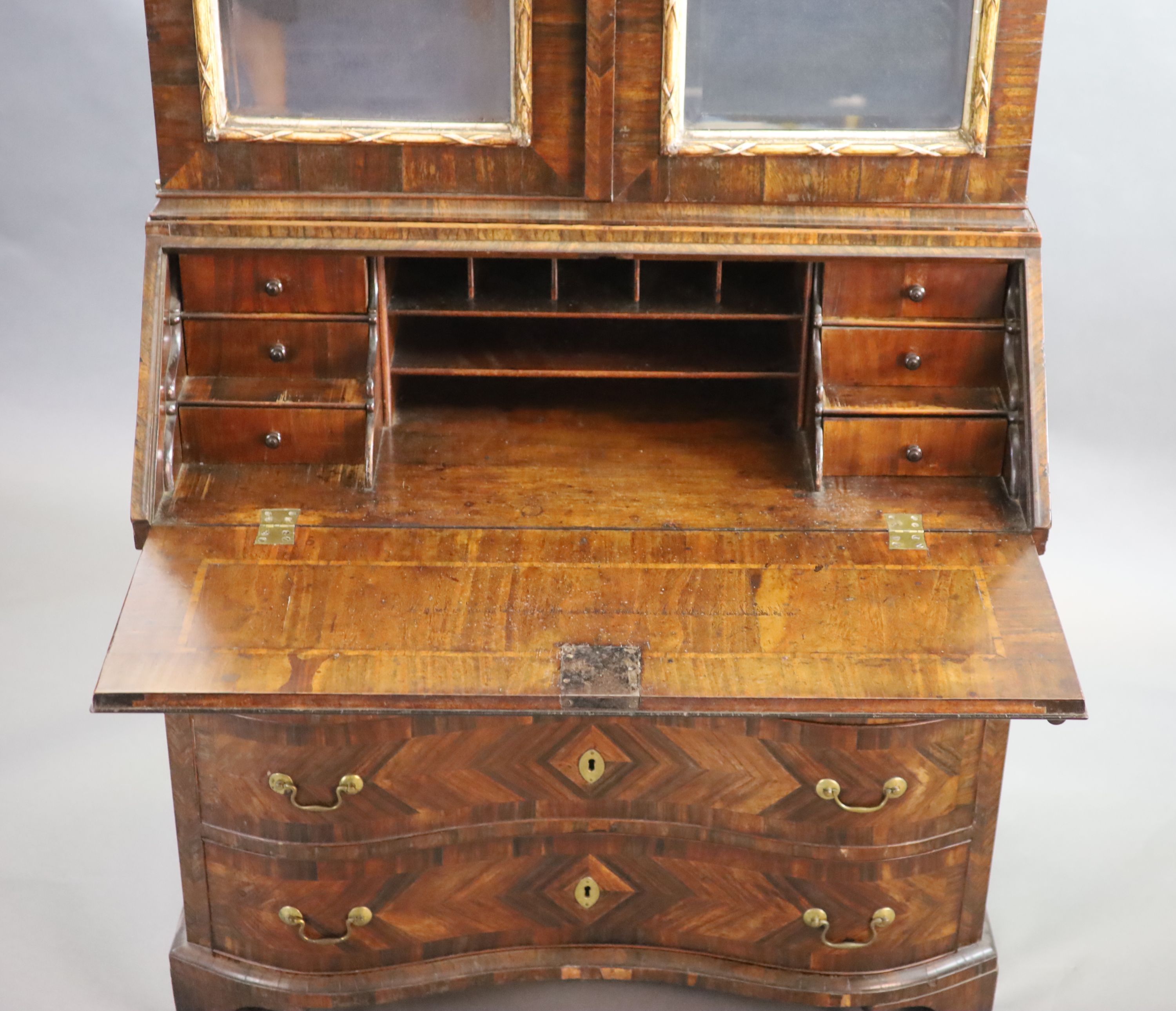 A mid 18th century Italian rosewood parquetry and parquetry bureau bookcase, W.107cm D.57cm H.237cm.